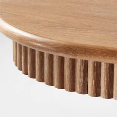 a close up view of the top of a table with wooden slats on it