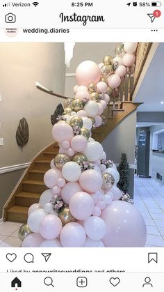 the staircase is decorated with pink and gold balloons