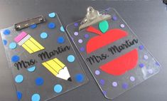 two plastic clipboards with magnets on them that read, mrs martin and miss martin