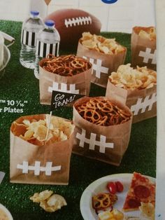 a magazine cover with some food on the grass and snacks in paper bags next to it