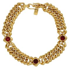 YVES SAINT LAURENT vintage iconic gold toned curb chain necklace embellished with three ruby red crystals. Hook clasp closure. Embossed YSL Made in France. Indicative measurements : length approx. 38 cm (14.96 inches) / width approx. 2.2 cm (0.87 inch). NOTES - This is a preloved vintage item, therefore it might have imperfections. - Colors may differ slightly from actual product appearance due to differences in lighting conditions. - As a buyer, you are fully responsible for customs duties, other local taxes and any administrative procedures related to imports into the country of destination. Ysl Necklace, Ysl Vintage, Saint Laurent Vintage, Curb Chain Necklace, Red Necklace, Jewelry Lookbook, Cross Bracelet, Hook Clasp, Vintage Jewels