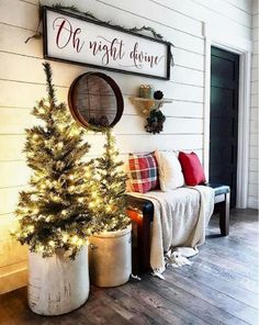 a small christmas tree in a pot next to a sign that says oh night drive