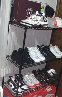 there are many pairs of shoes on the shelf