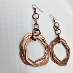 These unique vintage copper dangle earrings are the perfect touch of boho chic to any outfit, these earrings make a statement while adding a touch of elegance. Stand out from the crowd and add these must-have earrings to your collection today! Vintage Copper Dangle Details: vintage copper design 3 copper rings denim perfect great gift idea boho chic 3" drop Bohemian Brass Earrings In Rust Color, Handmade Vintage Rust Earrings, Handmade Rust Vintage Earrings, Handmade Vintage Rust-colored Earrings, Bohemian Rust Brass Earrings, Bohemian Nickel-free Rust Earrings, Bohemian Bronze Metal Earrings, Vintage Rust-colored Nickel-free Earrings, Bohemian Rust-colored Nickel-free Earrings