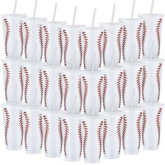 many white cups with red stitches on them are lined up and ready to be eaten