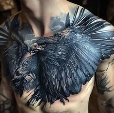 a man with an eagle tattoo on his chest