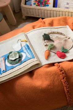 an orange pillow with various items on it