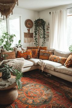 a living room filled with lots of furniture and plants on top of a rug in front of a window