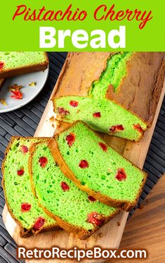 a close up of bread on a cutting board with the words pistachio cherry bread