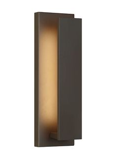 an outdoor wall light that is on the side of a white wall and has a brown finish