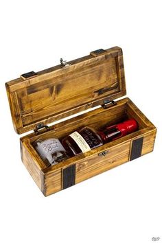 an open wooden box with two bottles in it