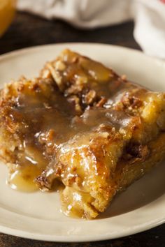 a piece of bread pudding on a plate with a fork