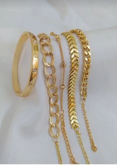 "\"Gold Plated Bracelet Combinations - Where Elegance and Style Meet These unique gold-plated bracelet combinations are designed to introduce you to sophistication and style. Handcrafted with care and curated materials, these bracelets are individually designed and meticulously curated to complement each other perfectly. With their elegant designs, intricate craftsmanship, and gold tones, these bracelets are the perfect complement for any style. As pioneers of the minimalist jewelry trend, these Bracelet Combinations, Elegant Designs, The Minimalist, Gold Plated Bracelets, Handcrafted Earrings, Jewelry Inspo, Exquisite Jewelry, Minimalist Jewelry, Stylish Accessories