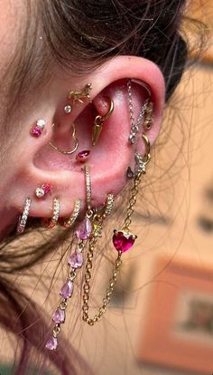 Ear Set Up Ideas, Pink Ear Curation, Maximalist Ear Stack, Gothic Ear Piercings, Maximalist Ear Piercings, Cute Piercings Face, Fun Piercings, Curated Ear Piercing