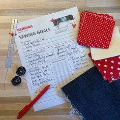 sewing supplies laid out on a wooden floor