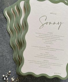 a green and white menu card with the word sorry on it