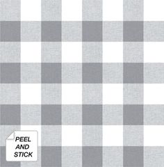 a gray and white checkered fabric with a ruler in front of the plaid pattern