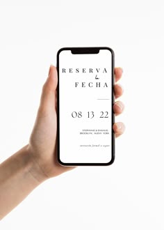 a person holding up a cell phone with the text reserved fecha on it