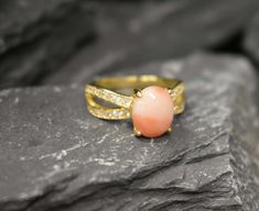 Pink Coral Ring set with a Natural Angel Skin Coral in a top grade & natural color, at 10x8mm size (3 Cts) from Italy.Gold Vermeil: 18k Gold over Solid 925 Sterling Silver ☞ made to last.Click here for ☞ Matching Earrings Matching Pendant ☞ Please ask meClick here for ☞ Coral Jewelry CollectionDetails:• Natural Angel Skin Coral sourced from Italy• Coral: 10x8mm, 3 Ct, cabochon cut• Dimensions: Band width ≈ 2.2mm, thickness ≈ 1mm• 18k Gold Vermeil❀ Each Natural Gem is unique & will have Slight va Engagement Ring Gold Vintage, Gold Vintage Ring, Angel Skin, Mother Rings, Coral Ring, Natural Coral, Coral Jewelry, March Birthstone, Pink Coral