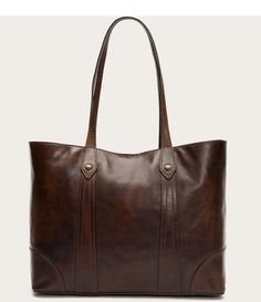 From Frye&#x2C; the Melissa Washed Leather Shopper Tote features:Antique pull-up leatherSnap closureFabric lining4 pockets insideApprox. 12"H x 18"W x 6"D; 10.5" handle dropImported. Frye Bags, The Frye Company, Luggage Store, Structured Bag, Buy Bags, Brown Leather Totes, Cheap Bags, Tote Bag Leather, Shopper Tote