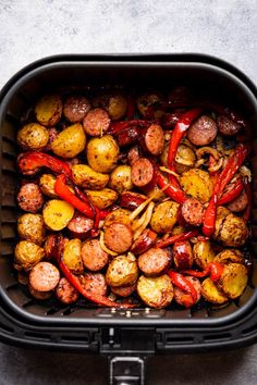 cooked potatoes and red peppers in an air fryer