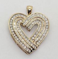 LVJewelryBuyers Auctions: Welcome to LV Jewelry Buyers of Las Vegas. We are a closeout jewelry store in the Las Vegas area that has been buying and specializing in all types of Jewelry for over 15 years. We purchase closeout New and Pre-owned jewelry and offer it to the public at HUGE discounts. All of our Jewelry is made from the Finest materials and inspected and evaluated by a certified jewelry specialist before being listed for sale and guaranteed to be as described. Make sure to take a look at all our auctions for more great Deals! $3750 Large Huge 2.00 Carat Yellow Gold Diamond Heart Pendant Great Design You are looking at a very large and unique 2.00 Carat Yellow Gold Diamond Heart Pendant. This pendant has a Retail price of $3750 you will sure draw a crowd. This Diamond Heart featu Lv Jewelry, Types Of Jewelry, Baguette Diamonds, Heart Pendant Diamond, Baguette Diamond, Fine Jewellery Necklace, Diamond Color, Diamond Heart, Diamond Clarity