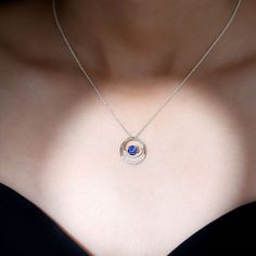 Product Details If you want to fortify your relationship and make it enduring, consider our Created Blue Sapphire Pendant Necklace as the ideal option. The necklace boasts a 6 MM Round Cut Created Blue Sapphire securely held in a Prong Setting and encircled by dazzling Round Moissanite on an open circle pendant. Product Information SKU SHP-PENDANT032214587 Weight 2.40 gm (Approximate) LAB CREATED BLUE SAPPHIRE INFORMATION No.of Stones 1 Pieces Total Weight 1.05 Carat (Approximate) Dimension(appr Royal Blue Round Jewelry For Anniversary, Sapphire Color Lab-created Sapphire Necklace For Anniversary, Blue Lab-created Sapphire Necklace For Anniversary, Anniversary Sapphire Necklace With Lab-created Sapphire, Anniversary Sapphire Necklace With Lab-created Gem, Tanzanite Round Necklaces For Anniversary, Blue Tanzanite Jewelry With Halo Design, Anniversary Necklace With Lab-created Sapphire Birthstone, Royal Blue Jewelry With Brilliant Cut As Gift