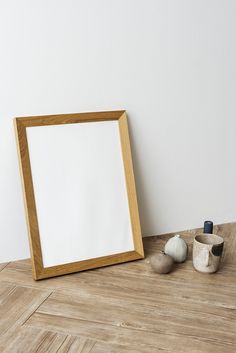 a wooden frame sitting on top of a hard wood floor next to an egg holder