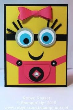 a card made to look like a minion with big eyes and a pink bow