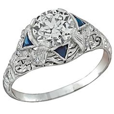 This fabulous platinum engagement ring from the Art Deco era, is centered with a sparkling GIA certified round brilliant cut diamond that weighs 1.57ct. and is graded I color with SI1 clarity. The center stone is accentuated by sparkling diamond and triangular cut sapphire accents. The ring is size 8 3/4, and can be resized. Inventory #24682KSSS Platinum Engagement Ring, Engagement Ring Photos, Platinum Diamond Engagement Rings, Big Diamond, Platinum Engagement Rings, Art Deco Engagement Ring, Put A Ring On It, Art Deco Ring, Jewelry Rings Engagement