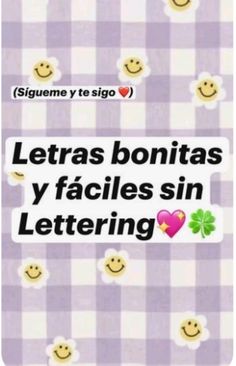 a purple and white checkered table cloth with smiley faces on it, the words letras