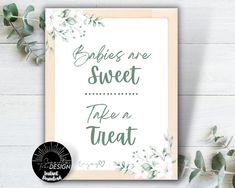 a card with the words babies are sweet take a treat on it next to eucalyptus leaves