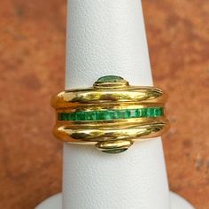 Collectible Yellow Gold Emerald Ring With Cabochon, Collectible Yellow Gold Emerald Cabochon Ring, Gold Emerald Cabochon Ring For Formal Occasions, Classic Gold Emerald Cabochon Ring, Luxury Gold Emerald Ring Collectible, Luxury Gold Emerald Collectible Ring, Heirloom Gold Emerald Cabochon Ring, Yellow Gold Emerald Cabochon Ring For Anniversary, Gold Emerald Cut Ring For Collectors