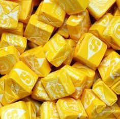 yellow candy cubes with white designs on them