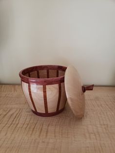 two wooden bowls sitting on top of a table