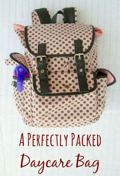 a polka dot backpack with the words, a perfectly packed day care bag