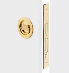 an image of a door handle and knob on a white door with gold trims