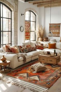 a living room filled with furniture and lots of windows