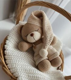 a stuffed animal is sitting in a basket