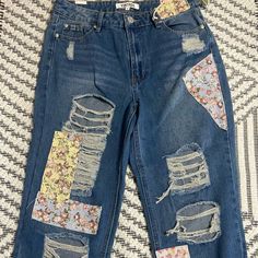 Vintage Almost Famous Distressed Patchwork Jeans Sz 9 Ripped/Raw Hem Nwt Floral Patchwork On Distressed Jeans. The Bottom Hem Is Raw Edge. Waist Measurement Is 30 Inches, Inseam Is 27 Inches. Casual Blue Bottoms With Floral Patchwork, Blue Patched Jeans For Spring, Spring Blue Jeans With Patches, Floral Patchwork, Patchwork Jeans, Waist Measurement, Almost Famous, Jeans Color, Raw Edge