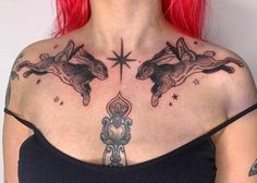 a woman with red hair has tattoos on her chest