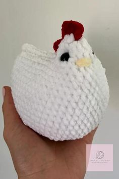 a crocheted chicken with a red hat on it's head is shown