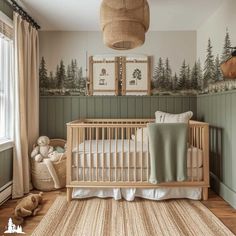 a baby's room with a crib, stuffed animals and pictures on the wall