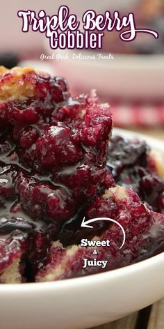 a close up of a plate of food with blueberry cobbler on it's side