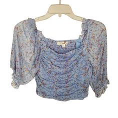 Rewind Blue Floral Double Cinch Mesh Top/Blouse Condition: New With Tags Size: Women's Small Material: 96% Polyester, 4% Spandex Lining: 100% Polyester Armpit To Armpit 13 Inches Length (Top Of Collar To Bottom Of Shirt) 15 Inches Please Email With Your Questions Prior To Your Purchase. Thank You! Blue Ruched Tops For Spring, High Neck Lace Top, Light Pink Blouses, Tie Crop Top, Orange Blouse, Cold Shoulder Blouse, Crop Top Shirts, Striped Hoodie, Comfortable Tops