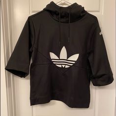 Brand: Adidas Condition:New Without Tags. Size:Xs Color: Black With White Adidas Logo. Details: Hoodie With 3/4 Oversized Sleeves. Adidas Black Sweatshirt With Drawstring Hood, Adidas Hooded Sports Top, Adidas Hooded Sportswear Top, Adidas Sportswear Hooded Top, Adidas Sporty Winter Tops, Urban Black Adidas Tops, Adidas Athleisure Tops For Winter, Adidas Tops With Ribbed Cuffs For Streetwear, White Adidas Hoodie Tops