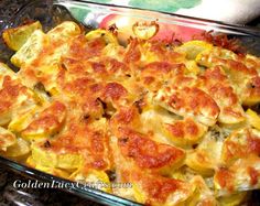 a casserole dish with cheese and vegetables in it