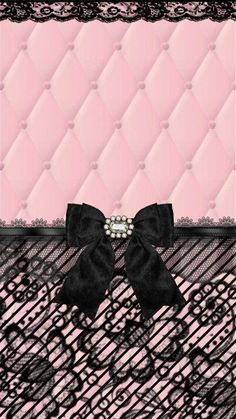 a pink and black wallpaper with a bow tie on it's headband