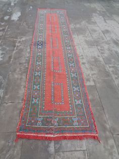 an old rug is laying on the ground