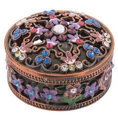 an ornately decorated box with flowers on it